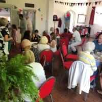 People having cream tea