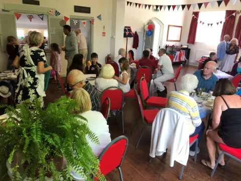 People having cream tea