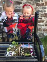 Children dressing the well