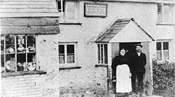 Old black and white photo of village shop